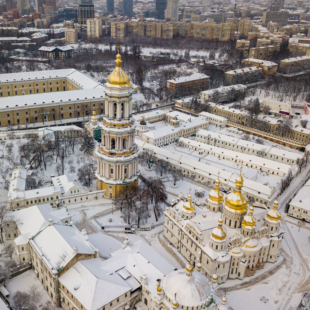 Kiev Pechersk Lavra, covered with snow. Cloudy winter morning. Aerial drone view.